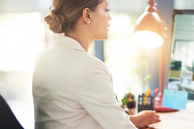 A young professional working at her desk.