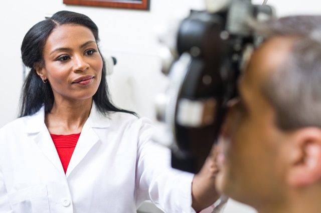 An optometrist examining a patient's eyes.