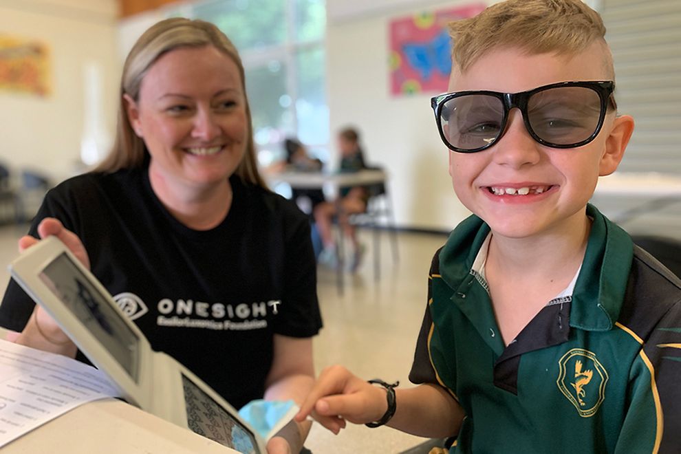 woman with small boy in oversized sunglasses