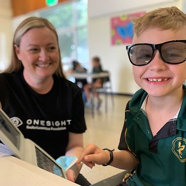 woman with small boy in oversized sunglasses