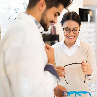 A young woman browsing glasses