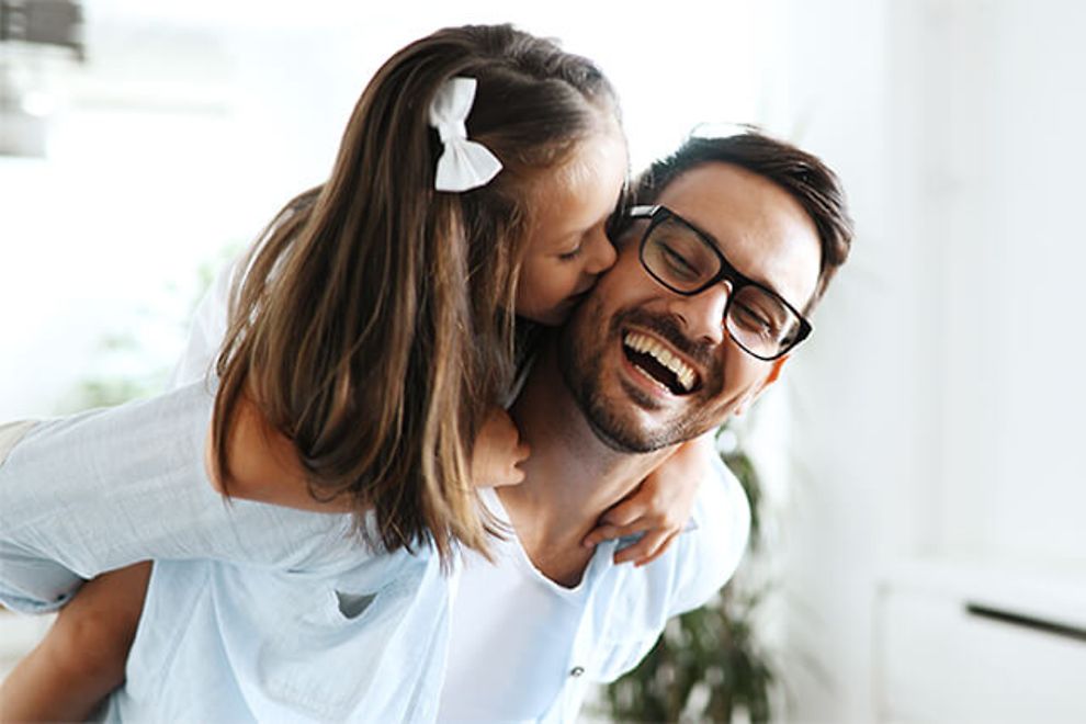 Father and daughter laughing