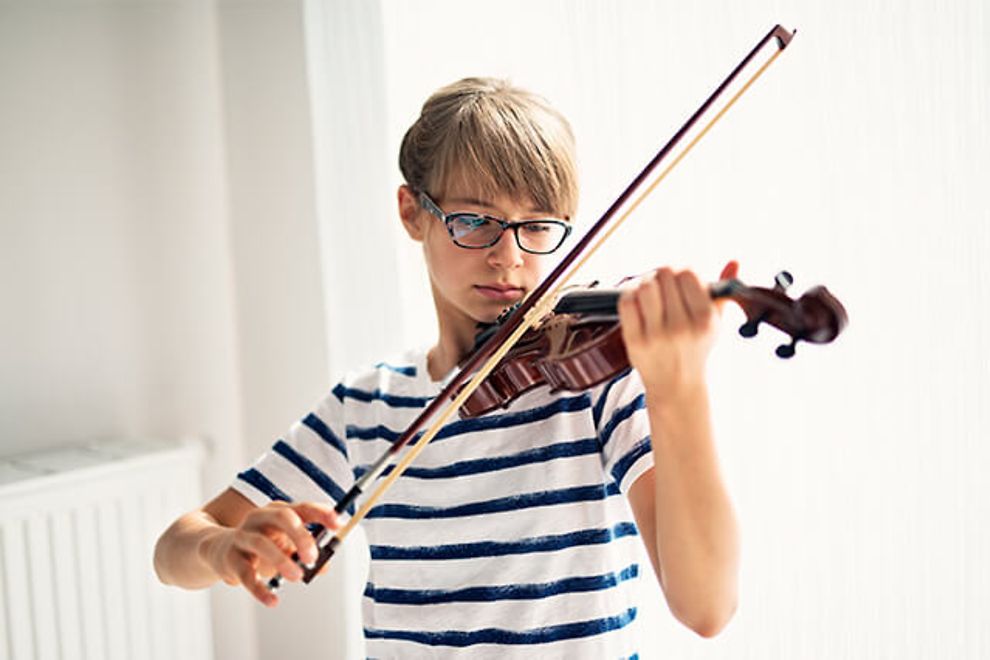 Young girl playing violin