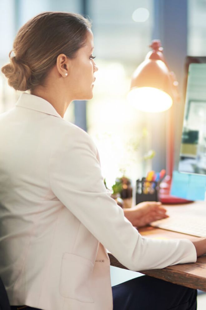 A young professional working at her desk.