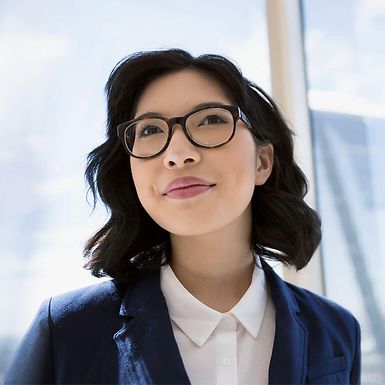 Young business woman wearing glasses.